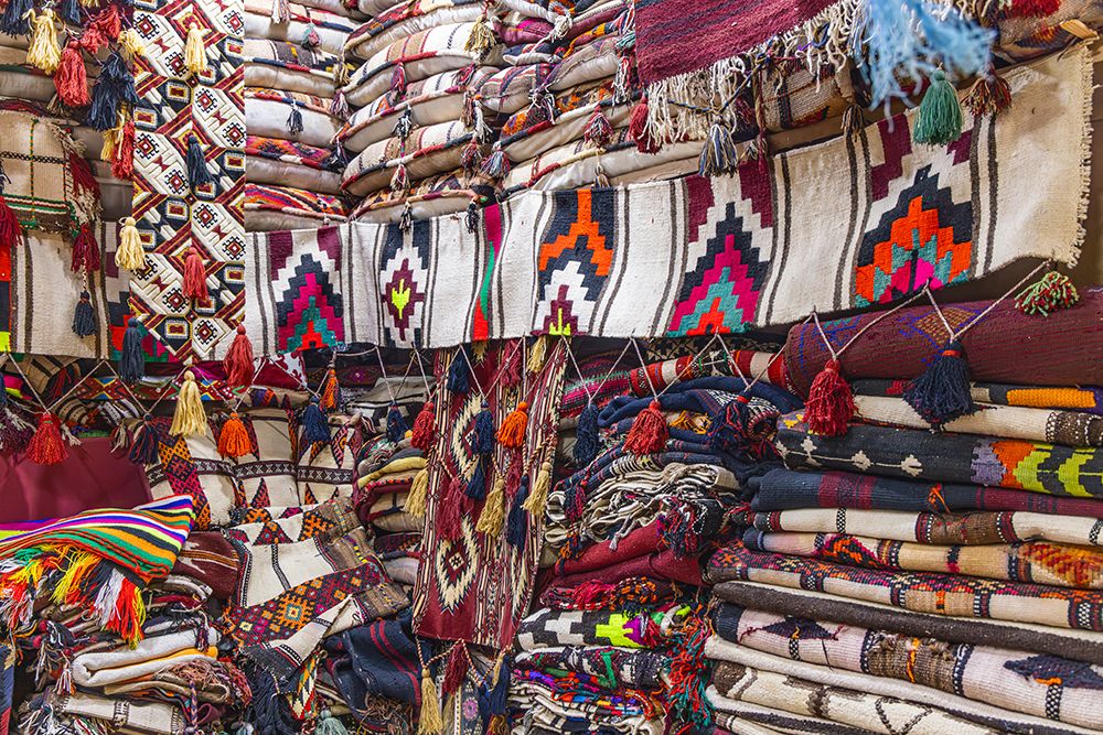 Saudi Arabia, Riyadh, Al-Dirah. Blankets, pillows and rugs at the Souq Al-Zal.
